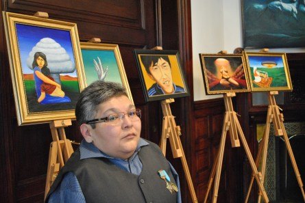 Karipbek with one of his paintings Photo: Patrick Gilsenan